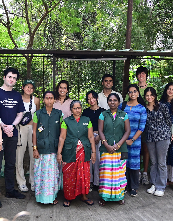 Research group with community workers in greenery